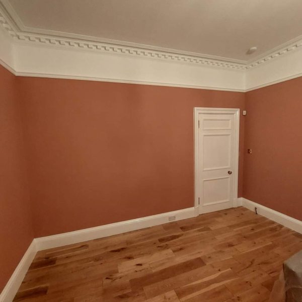 Before and after of a lounge painted in Lick Red 3